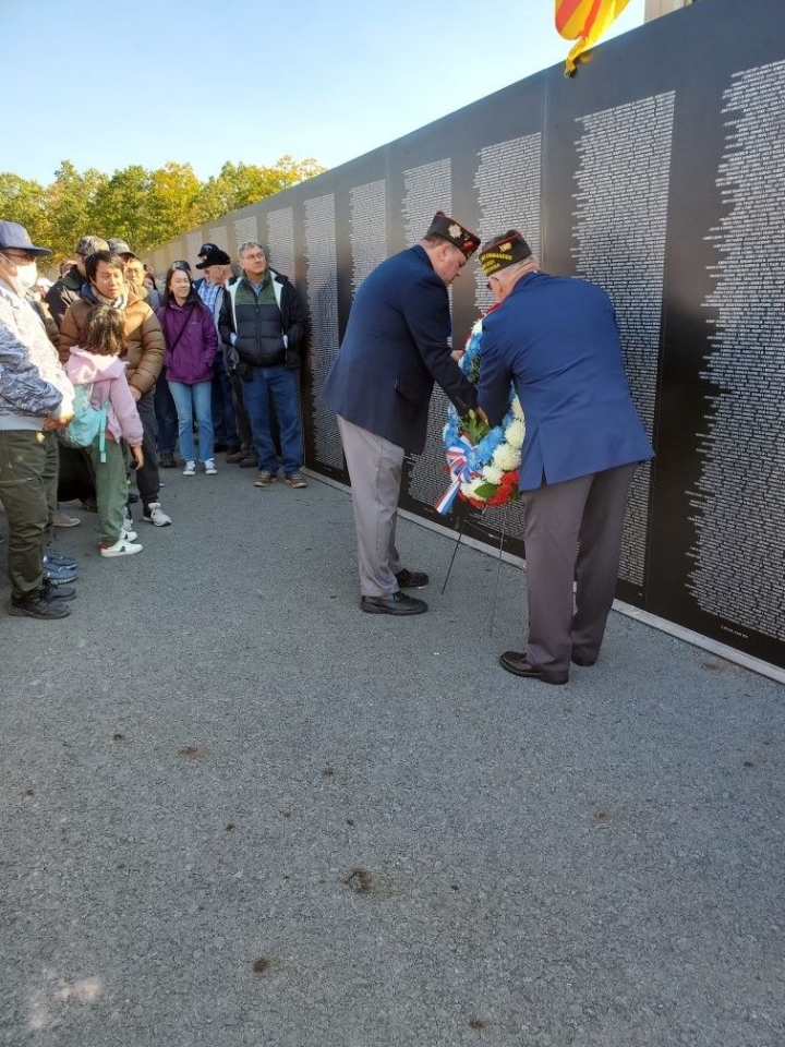 State Senior Vice Commander Nate Smith and commander Greg Protsko placing a wreath at the moving wall
